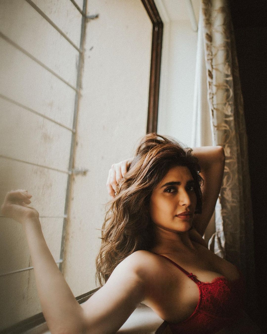 She also shared this sensuous photo in a red bra, perfect for the Valentine month. (Image: Instagram) She also shared this sensuous photo in a red bra, perfect for the Valentine month. (Image: Instagram)