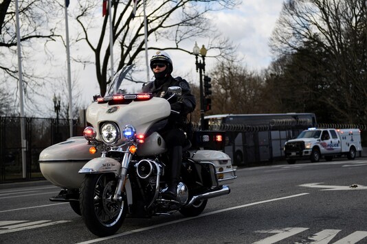 A police officer patrols on a motorcycle REUTERS/Brandon Bell - RC2SBL992FCB
