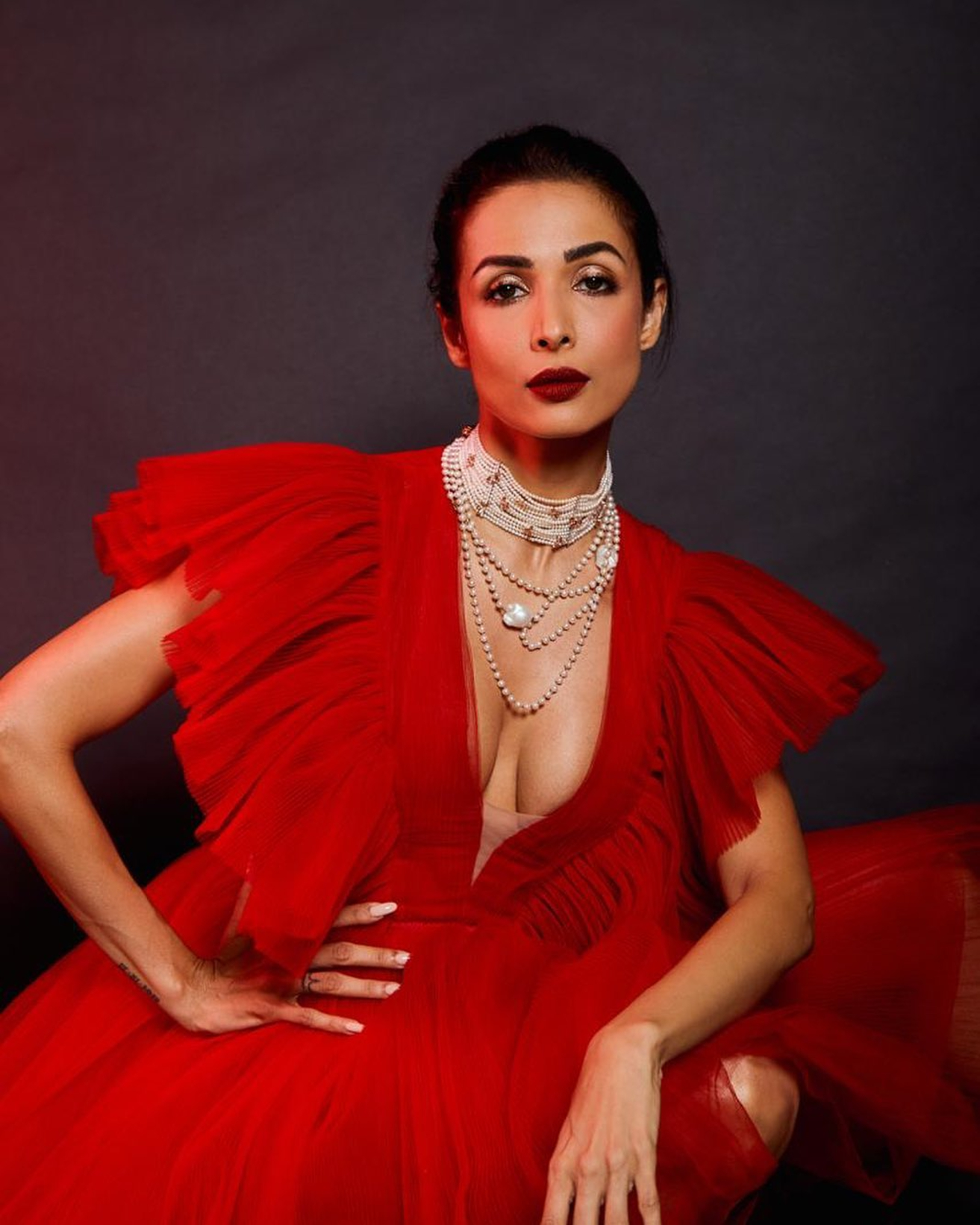 Malaika Arora stuns in a red outfit as she makes our eyes glue to her sultry appearance. (Credit: Instagram) Malaika Arora stuns in a red outfit as she makes our eyes glue to her sultry appearance. (Credit: Instagram)