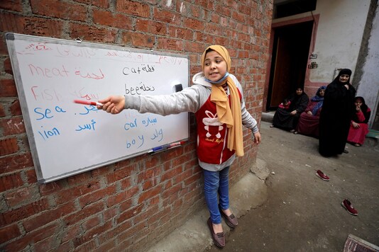 Khouly started using just a notebook before being given a blackboard and some chalk. Now she has a whiteboard and marker pens donated by a local company.
REUTERS/Mohamed Abd El Ghany