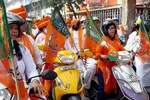 BJP Mahila Morcha workers took out a scooter rally in Siliguri on Thursday on the occasion of 53rd death anniversary of Deendayal Upadhyay.