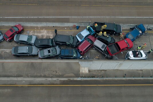Emergency responders work at a multi-car pileup on Sate Highway 45 near Briarwick Drive on Thursday, Feb. 11, 2021, in Austin, Texas. (AP)