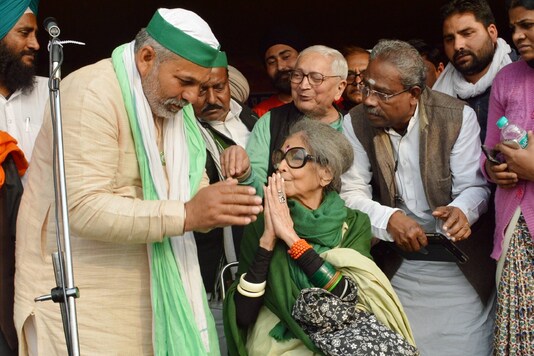 New Delhi: Tara Gandhi Bhattacharya, granddaughter of Mahatma Gandhi, with BKU spokesperson Rakesh Tikait at farmers' protest site in Ghazipur, Saturday, Feb. 13, 2021. (PTI Photo)