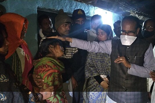MP Chief Minister Shivraj Singh Chouhan meets kin of victims in Sidhi bus accident. (Image: News18)