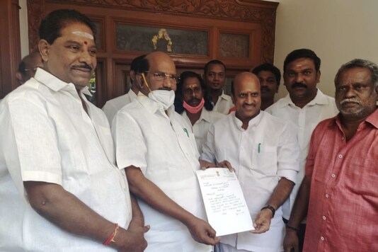 Congress MLA K Lakshminarayanan hands over his resignation letter to Puducherry Assembly Speaker VP Sivakozhundu. (ANI)