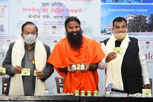 Baba Ramdev releases evidence based Patanjali medicine for COVID-19, in the presence of Union Ministers Nitin Gadkari  and Dr. Harsh Vardhan, during a press conference in New Delhi, Friday, Feb. 19, 2021. (PTI Photo/Kamal Singh)(PTI02_19_2021_000127B)