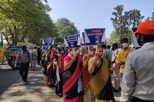 Teaching and non-teaching staff of private unaided schools across Karnataka staging a protest rally from Bengaluru city railway station to freedom park. Over 10 different associations including KAMS, KUSMA, ICSE and CBSE school managements protested against the 30% reduction in tuition fees.