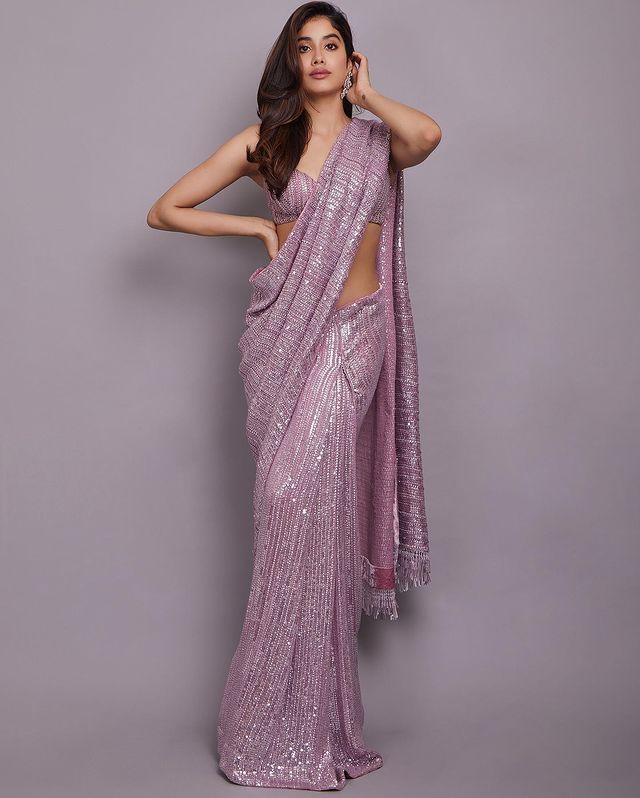 Janhvi Kapoor shows off her svelte figure in the purple sequinned nine yards. 