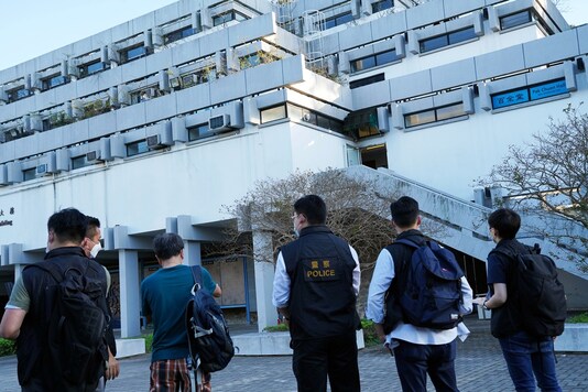Police officers from the National Security Department are seen at the Chinese University of Hong Kong, a day after a student march on the campus, in Hong Kong, China November 20, 2020. (REUTERS)