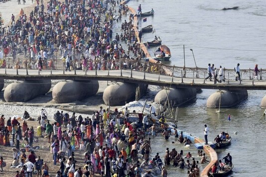 Prayagraj: Devotees gather to take holy dip in the River Ganga at Sangam on the occasion of 'Magh Purnima’ festival during ongoing 'Magh Mela', in Prayagraj, Saturday, Feb. 27, 2021. (PTI Photo)