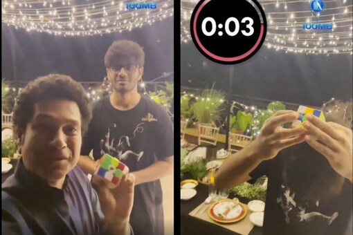 Video grab of Sachin Tendulkar with the young lad solving Rubik's cube.
(Credit: IG) 
