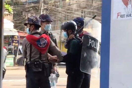In this grab from a video taken on Feb 27, Associated Press journalist Thein Zaw can be seen being arrested by police in Yangon, Myanmar. (AP Photo)