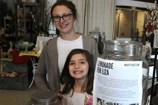 7-year-old girl sells lemonade to fund her brain surgery.
(Credit: AP)