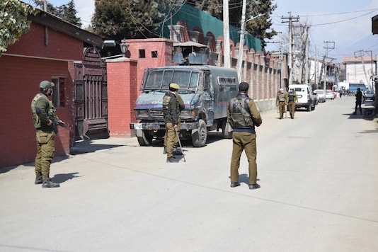 Security forces outside Mirwaiz Umar Farooq’s residence on Friday. (Photo: News18)
