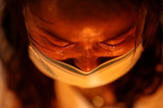 A woman cries as she mourns those who died in Myanmar during anti-coup protests. (REUTERS)