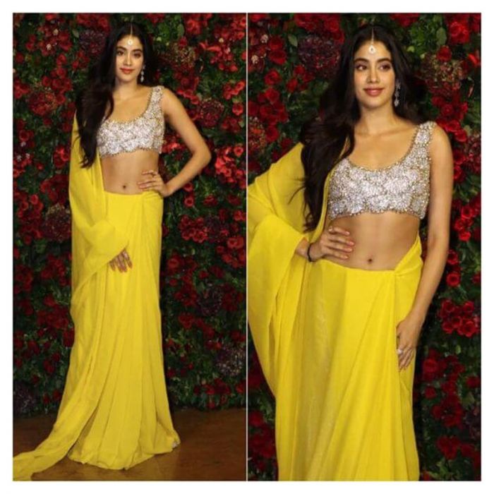 Janhvi Kapoor works her charm in the plain yellow saree with the embellished blouse. 