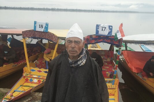 Boatman Nabi Ghulam  hopes for a turnout in his business.