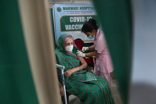 An elderly Indian woman receives COVID-19 vaccine at a private hospital in Gauhati, India. (AP Photo)