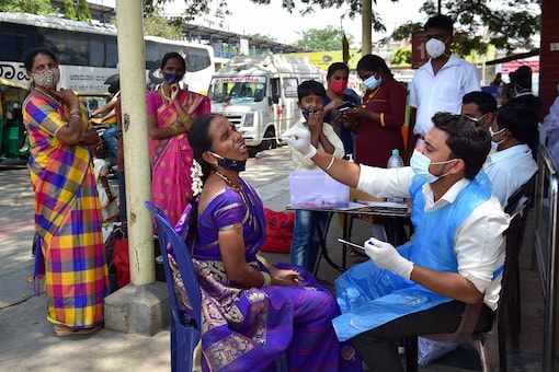 A health worker conducting COVID test in Bengaluru. (File photo: PTI)