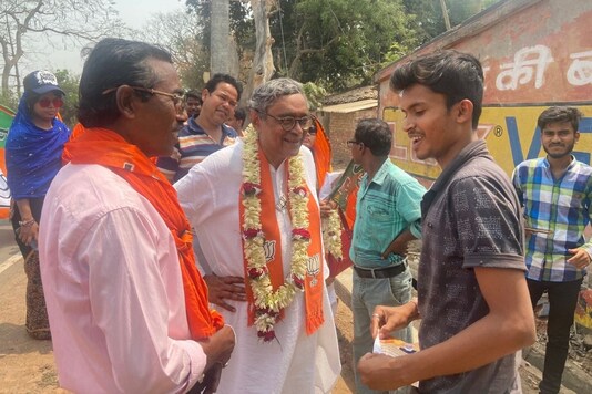 Swapan Dasgupta (in white) campaigns in Bengal's Tarakeshwar costituency.