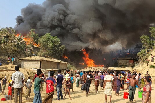 Smoke rises following a fire at the Rohingya refugee camp in Balukhali, southern Bangladesh, Monday, March 22, 2021. The fire destroyed hundreds of shelters and left thousands homeless, officials and witnesses said. (AP Photo)