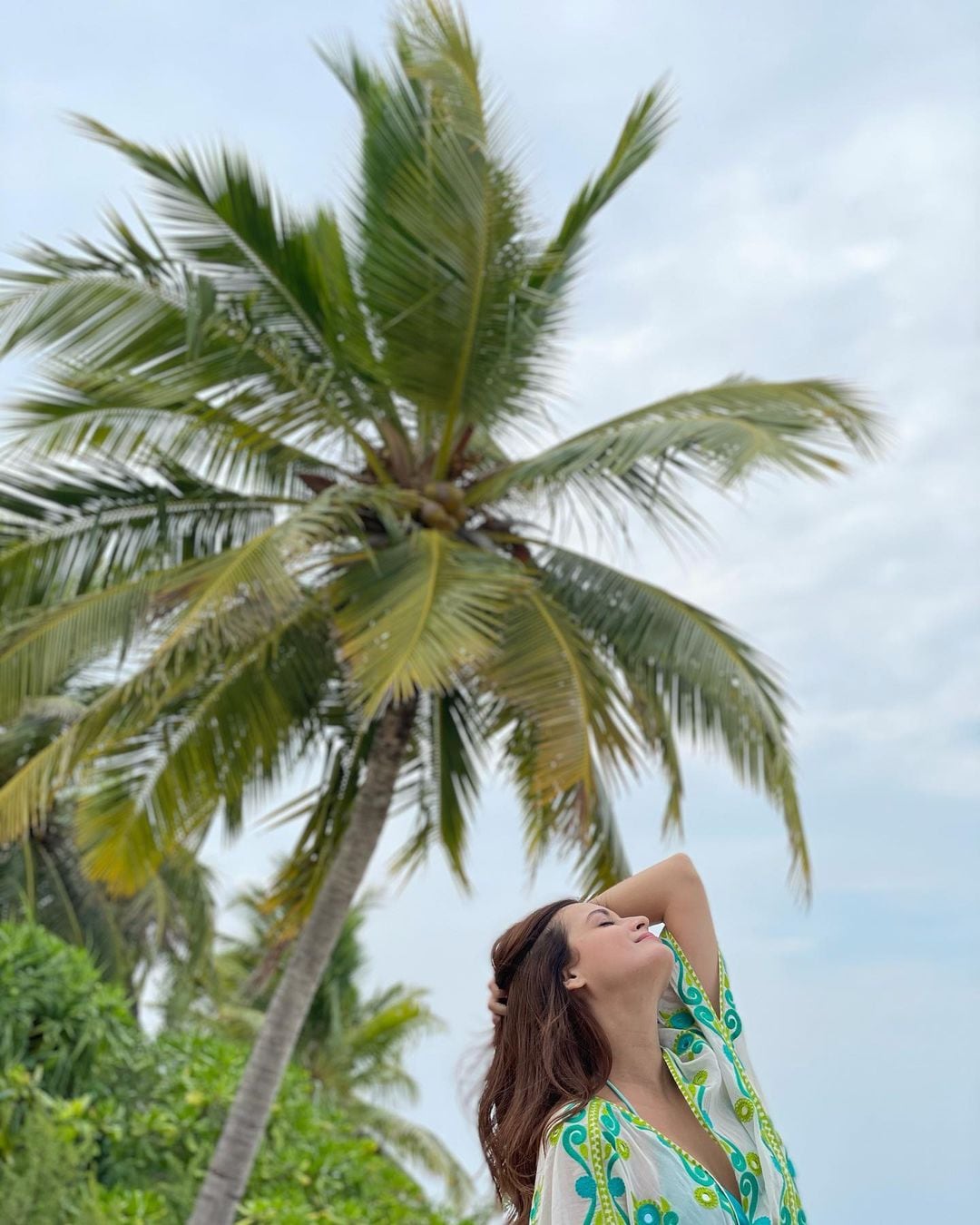  Dia Mirza looks picture-perfect against the swaying coconut trees. (Image: Instagram)