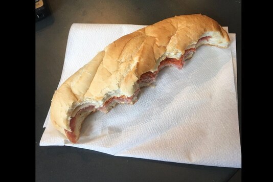 Netizens are troubled by this Twitter user's unreal ay of eating a sandwich.(Credit:  
@normalguycaruso)