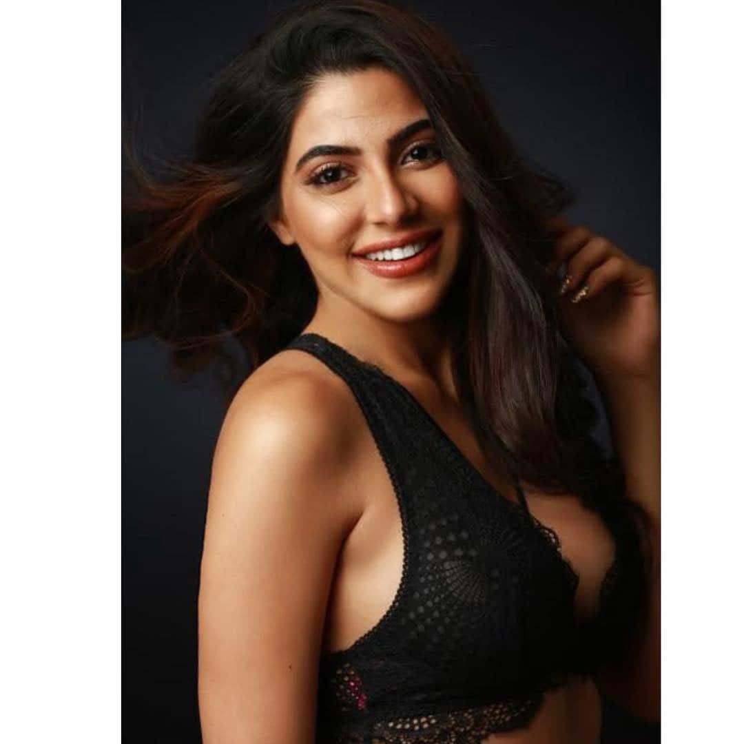 Nikki Tamboli flaunts her cleavage in a black bralette. (Image: Instagram) Nikki Tamboli flaunts her cleavage in a black bralette. (Image: Instagram)