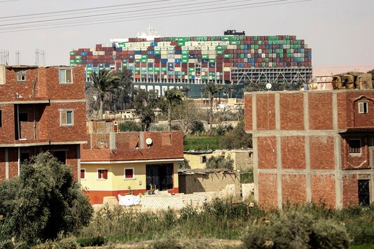 The Ever Given wedged across the Suez Canal and blocking traffic in the vital waterway. The sleepy farming village of Amer overlooks the Suez Canal. 

(AP Photo/Mohamed Elshahed, File)