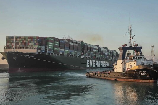 According to multiple reports, the Ever Given partially refloated after running aground last Tuesday in the crucial global shipping waterway. Satellite footage from MarineTraffic website showed that the ship’s bow had been wrested from the shore. Authorities had brought two more powerful tugboats into the canal, bringing the total to 14 tugs working on moving the ship. Photo: AP