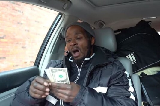 Video grab of homeless man breaking down after getting a donation.
(Credit: YouTube/ Daily Mail)