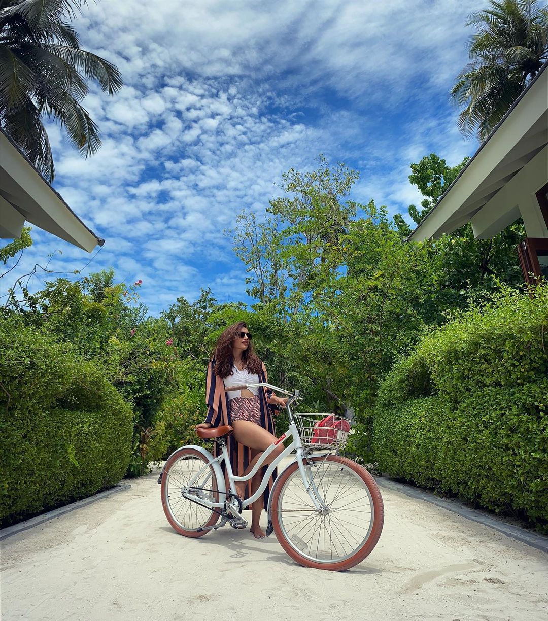  Surbhi shared photos of how she is spending her time in Madives. Posting a photo with a bicycle, she said, 