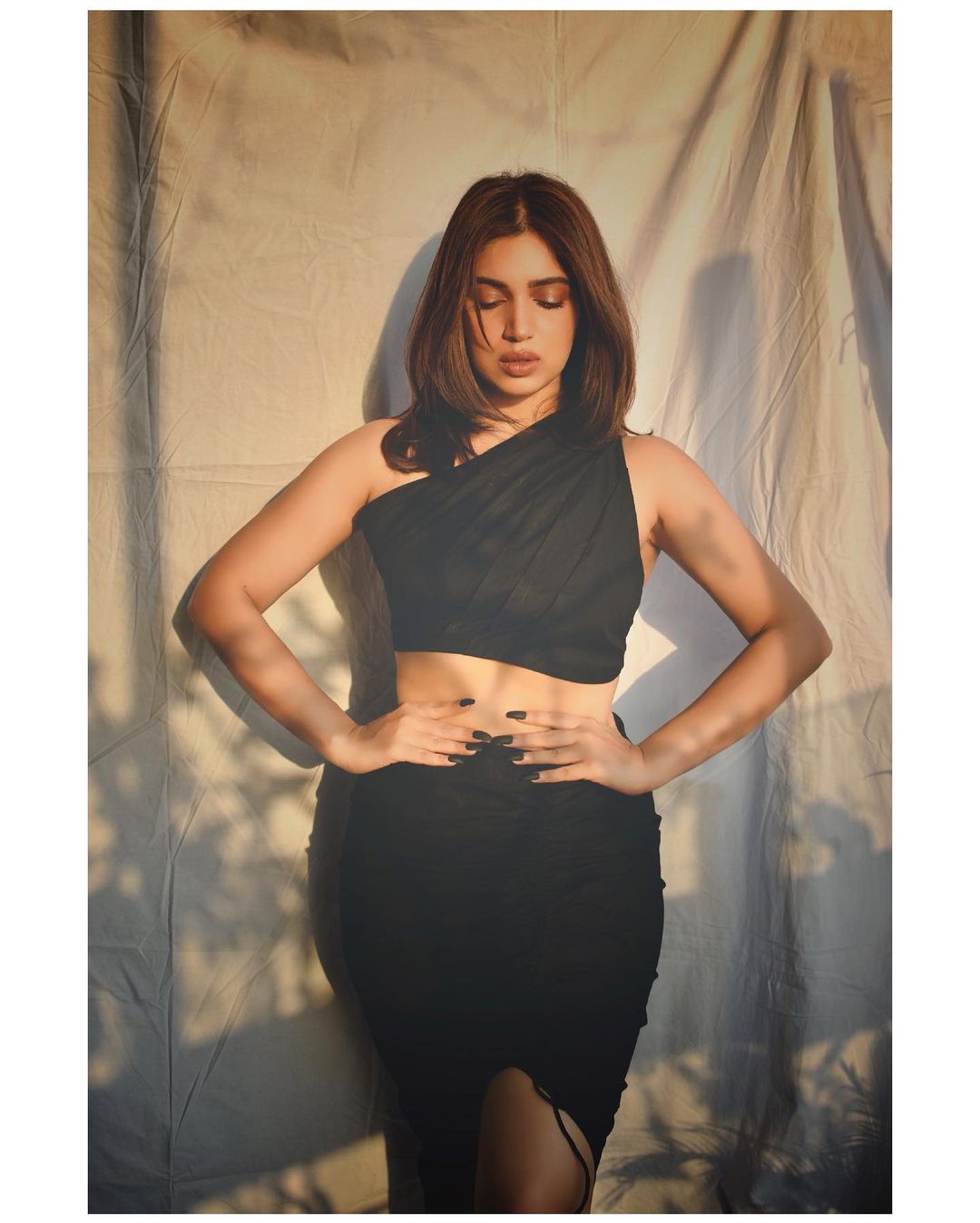  Bhumi Pednekar flaunts her sexy curves in a slit black shirt. (Image: Instagram)
