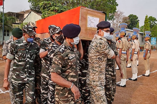 File pic of forces carrying body of a jawan killed in April 3 Maoist attack in Chhattisgarh. (PTI)
