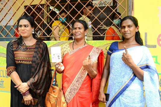 Voters show their finger marked with indelible ink after casting their votes in Chennai. (PTI)