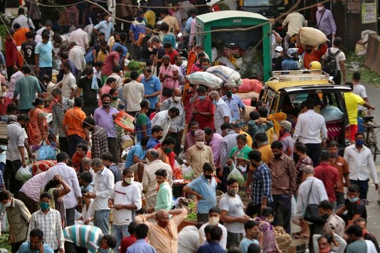 People at a crowded marketplace in Mumbai which has seen a huge spike in Covid cases. (Reuters)