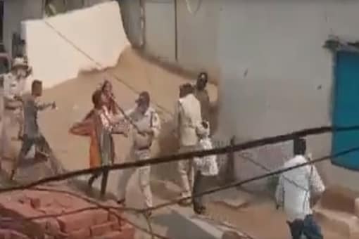 A video grab of policemen attacking family members of a coronavirus patient in MP's Khandwa.