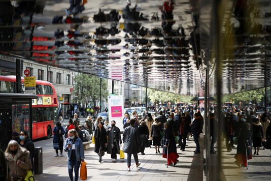 People walk at Oxford Street, as the coronavirus disease (COVID-19) restrictions ease, in London, Britain April 12, 2021. REUTERS/Henry Nicholls - RC2DUM9OS8BC