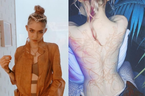 Grimes Shares Photo Of White Ink Tattoos On Her Back Calls Them Beautiful Alien Scars