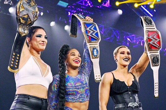 Raw Women’s Champion Rhea Ripley and SmackDown Women’s Champion Bianca Belair and NXT Women’s Champion Raquel Gonzalez (Photo Credit: WWE)