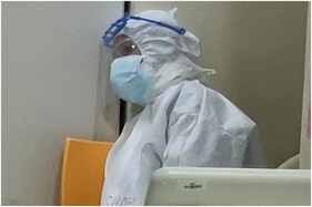 No Toilet Breaks, No Family Time: Grim Photo of Exhausted Nurse in PPE Goes Viral as Covid-19 Spikes