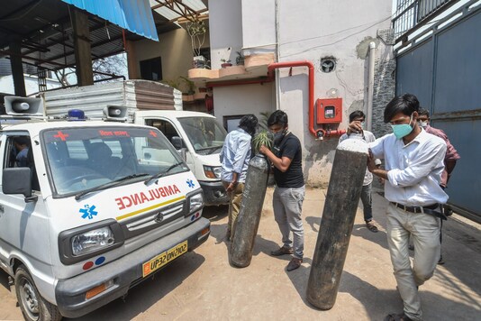 Oxygen cylinders being loaded, before being transported to hospitals for Covid-19 patients in Lucknow. (PTI Photo)