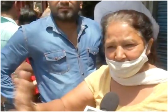 Delhi woman buying alcohol | Image credit: ANI