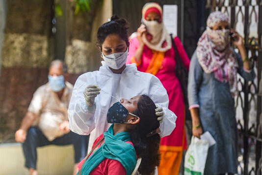 A medic conducts COVID-19 testing at Jain Hospital, as coronavirus cases surge in Mumbai, Monday, April 19, 2021.  (PTI Photo)