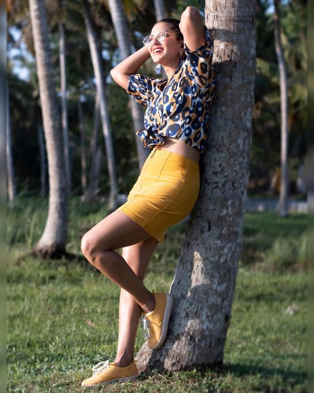  Sunny Leone looked stylish in the animal-printed shirt and mini skirt. (Image: Instagram)