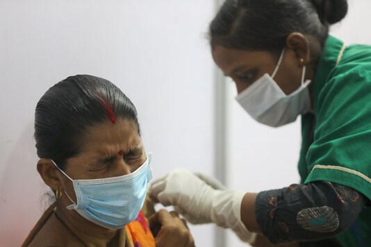 A woman receives a dose of Covishied vaccine in Mumbai. (Reuters)