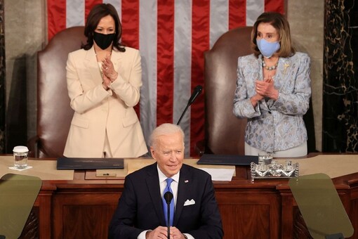 US President Joe Biden addresses a joint session of Congress as President Kamala Harris and Speaker of the House US Rep Nancy Pelosi (D-CA) react in the U.S. Capitol in Washington, DC, U.S. Reuters