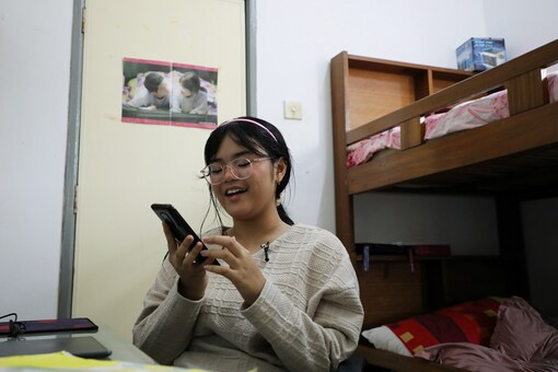 Malaysian teenager Ain Husniza Saiful Nizam uses her phone to check on the comments towards her TikTok vide.

REUTERS/Lim Huey Teng