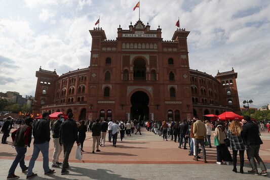 People queue to go inside Las Ventas bullring for the first bullfight in Madrid.

REUTERS/Susana Vera