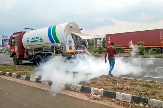 Medical oxygen leaks out from an oxygen tanker on Pune-Bengaluru Highway, in Satara, Wednesday. (PTI)